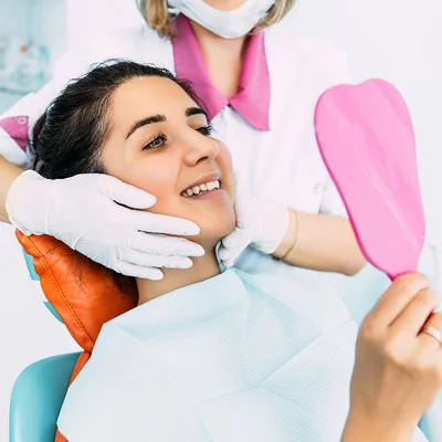 Dentist Twin Falls ID Happy Patient Checking Teeth