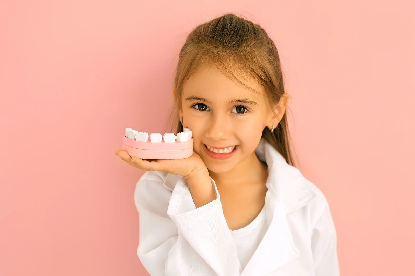 Dentistry Twin Falls ID Kid Holding Teeth Model
